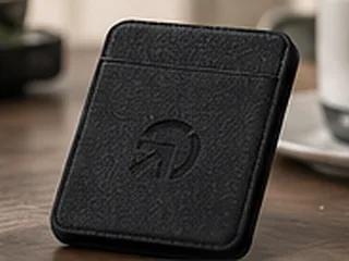 Concept rendering: a black card wallet with the PWM Pathway mark pressed into it.